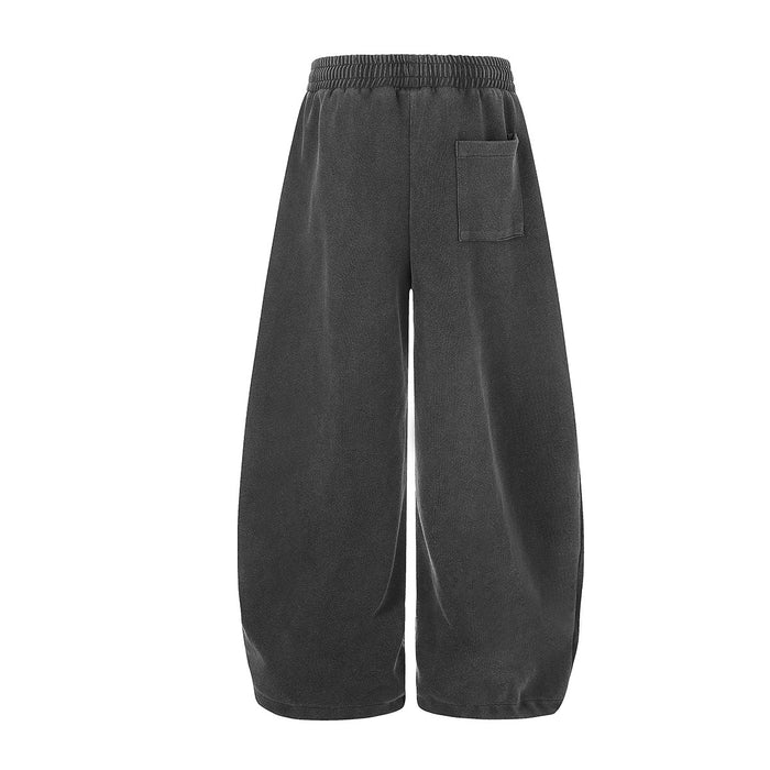Back view of black wide-leg sweatpants with a rectangular patch pocket