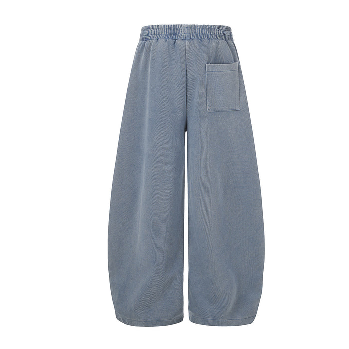 Back view of washed blue wide-leg sweatpants with a rectangular patch pocket