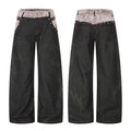 Black wide-leg jeans with grey faux fur contrast waistband, pyramid rivet studs, and tonal dragon embroidery on legs