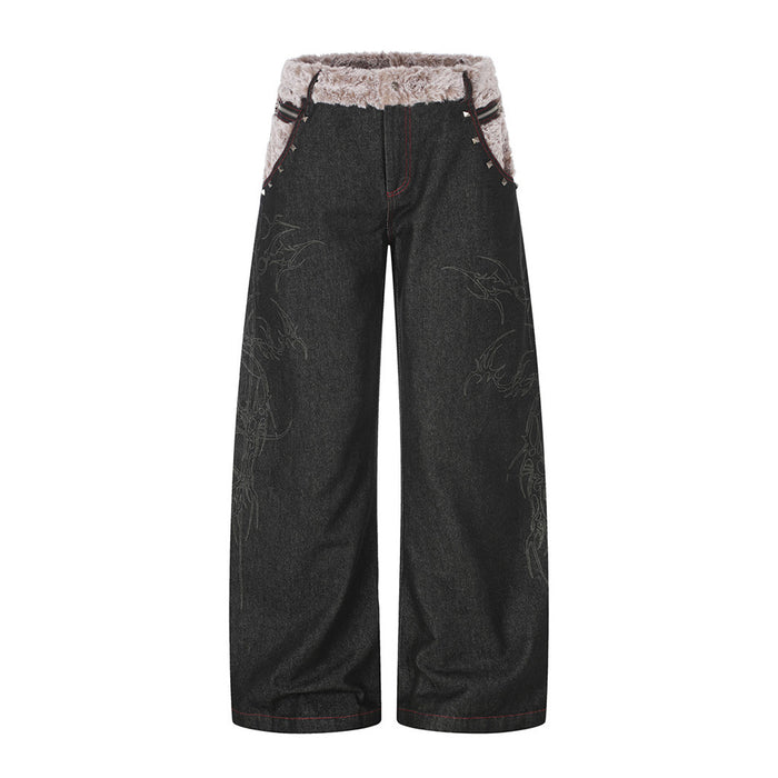 Front view of black wide-leg jeans with a taupe faux fur waistband, red stitching and subtle tonal motifs