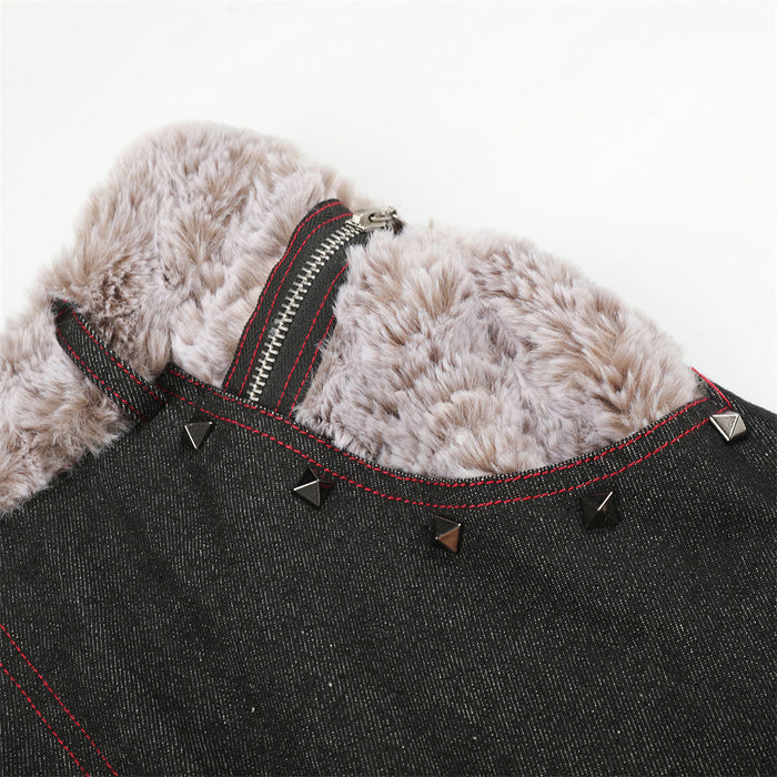 Detailed view of the faux fur waistband with a zipper, red stitching and small pyramid rivets on black denim