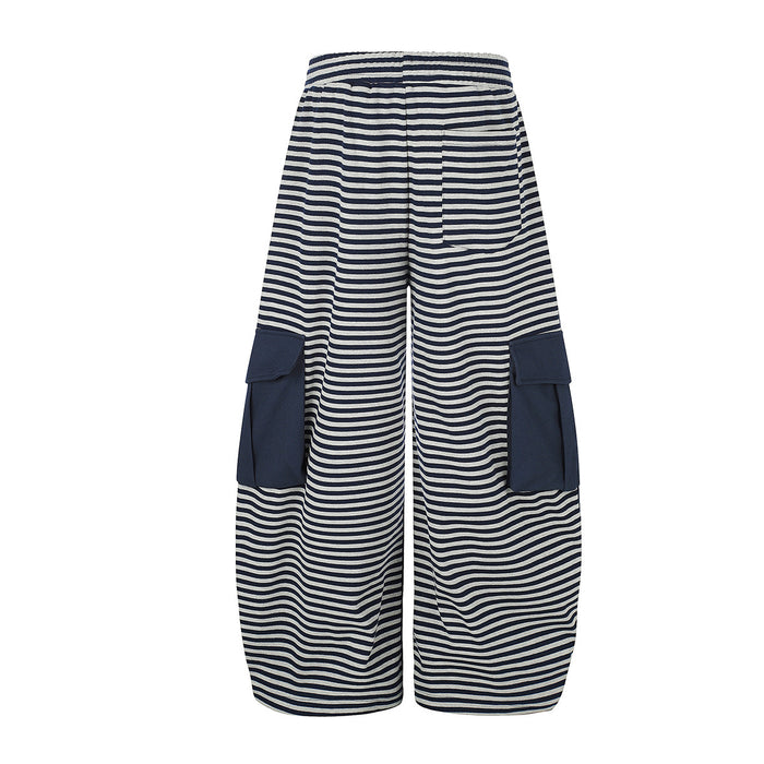 Back view of navy and gray striped wide-leg cargo pants with solid navy flap pockets