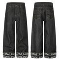 Men's black wide-leg denim jeans with studded back pockets and Union Jack rolled cuffs, front and back view