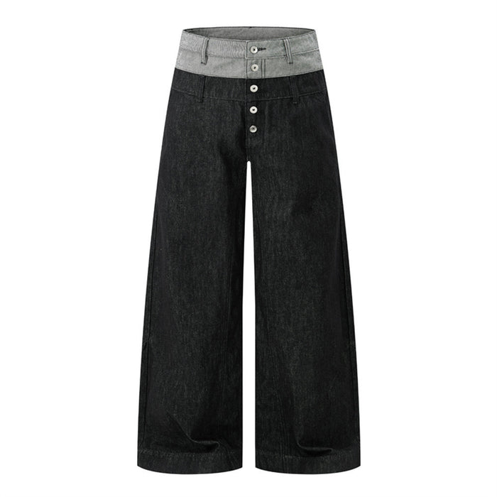Men's wide-leg black denim jeans with grey colorblock waistband and exposed button fly, front and back view
