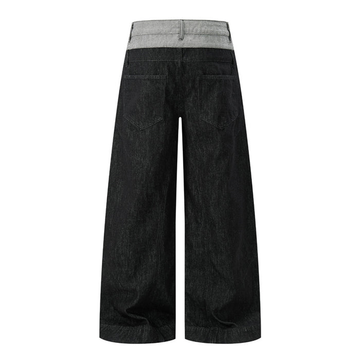 Back view of wide-leg black jeans with a contrasting gray waistband and two rear patch pockets