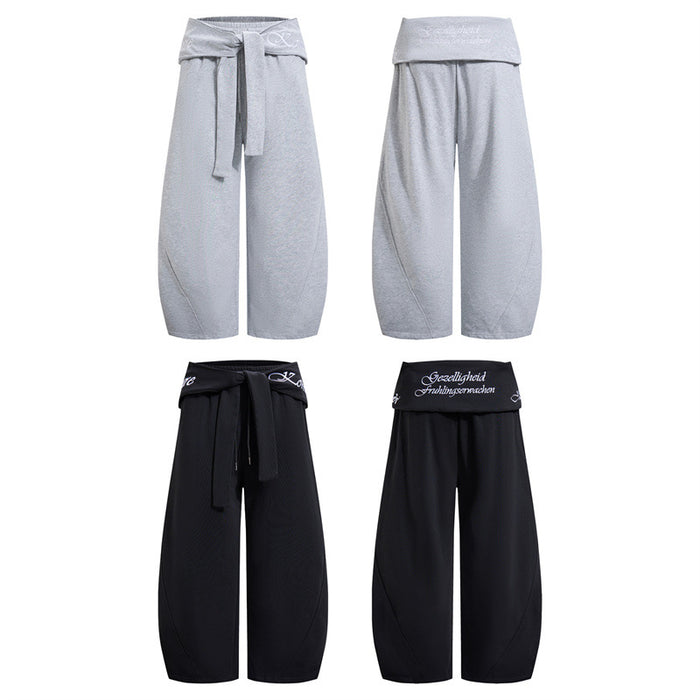 Four views of wide-leg pants in light gray and black, showing front and back waist designs with relaxed legs