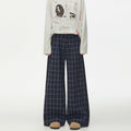 Navy blue windowpane plaid wide-leg trousers with button-fly placket, relaxed straight fit, front view
