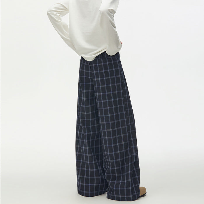 Back view of navy plaid wide-leg trousers showing the high waistband and wide legs