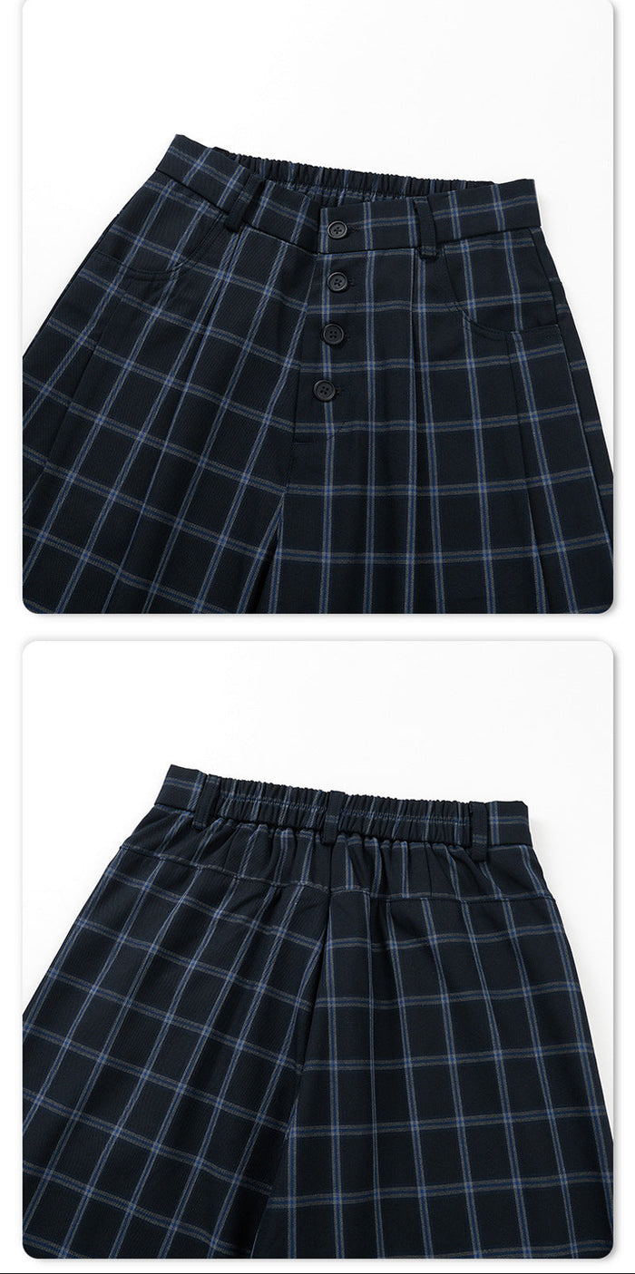 Split detail view showing the trousers' front button fly and back elastic waistband in navy plaid