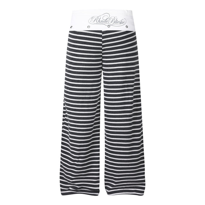 Back view of black and white wide-leg pants with a white waistband, gray script logo, and horizontal stripes