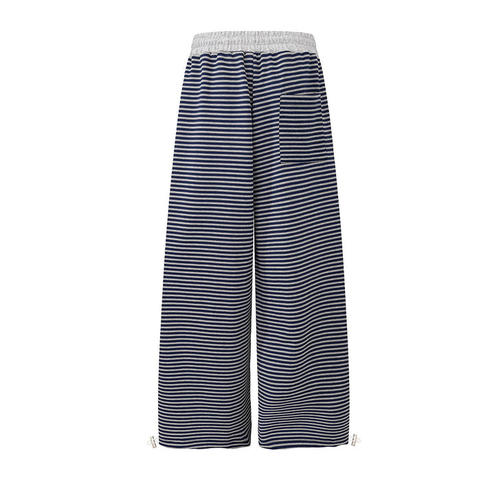 Back view of navy and white striped wide-leg sweatpants with a gray elastic waistband and plain legs