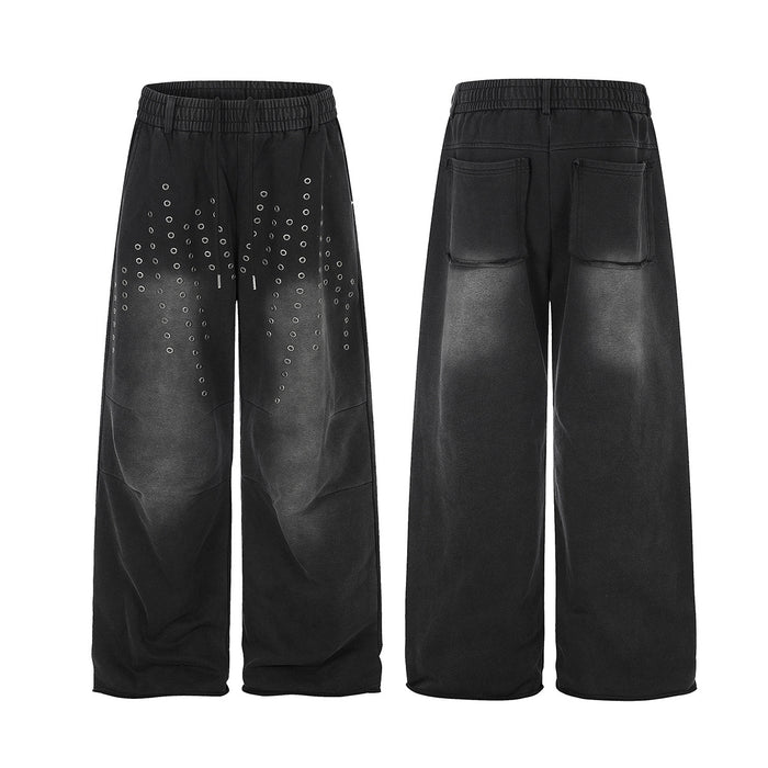 Black wide-leg sweatpants shown from front and back, with silver eyelets on the front and patch pockets at the rear