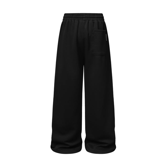 Back view of black wide-leg sweatpants with an elastic waistband and rectangular rear pocket