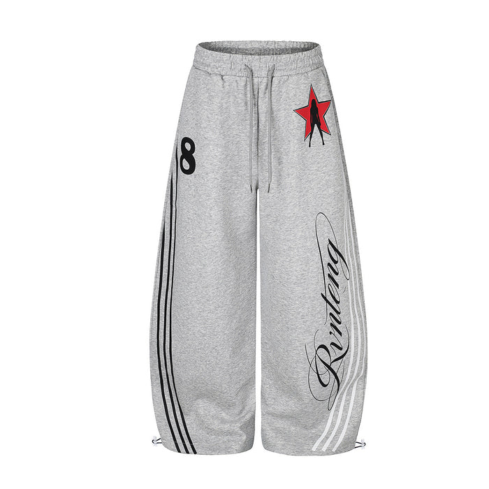 Wide-leg sweatpants in heather grey with retro side stripes, cursive script graphic print, and red star badge at the hip