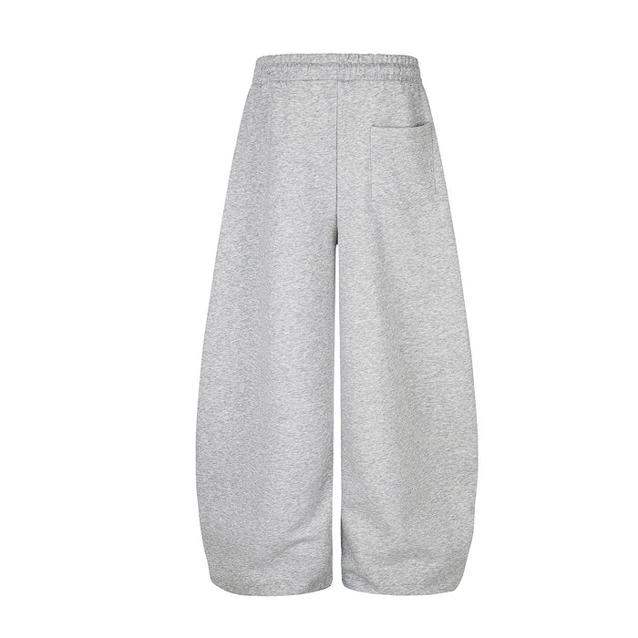 Back view of heather gray wide-leg sweatpants with a plain design, elastic waistband, and wide cuffs