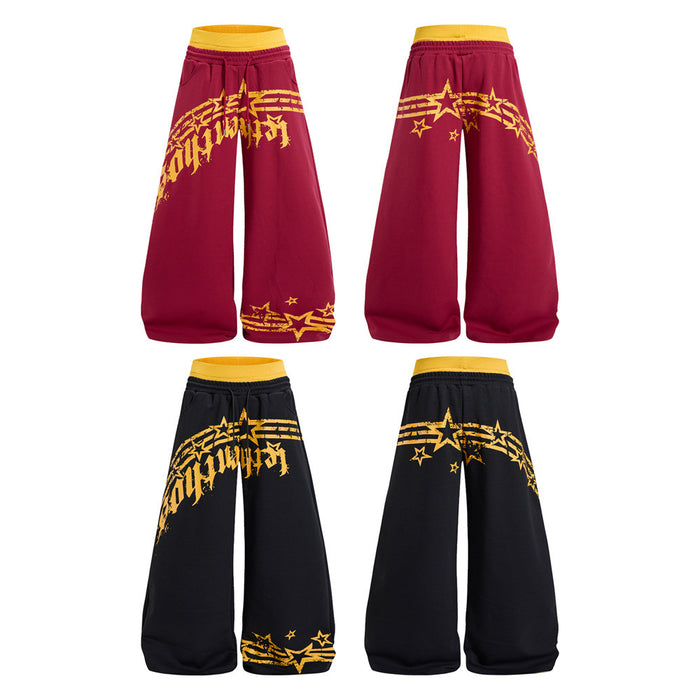 Front and back views of burgundy and black wide-leg sweatpants with yellow star graphics
