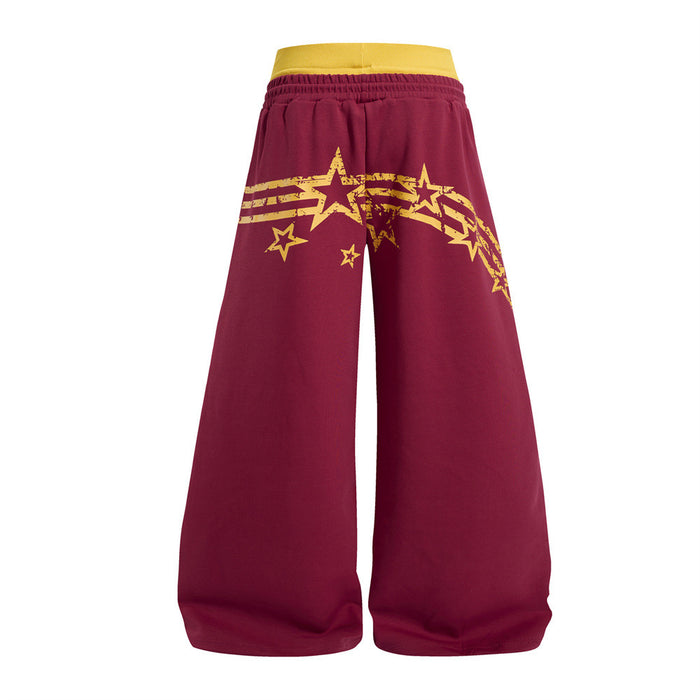 Back view of burgundy wide-leg sweatpants with a yellow waistband and star stripe graphic