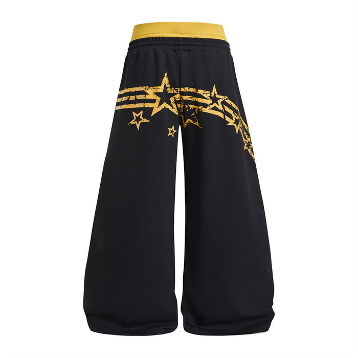 Back view of black wide-leg sweatpants with a yellow waistband and star stripe graphic