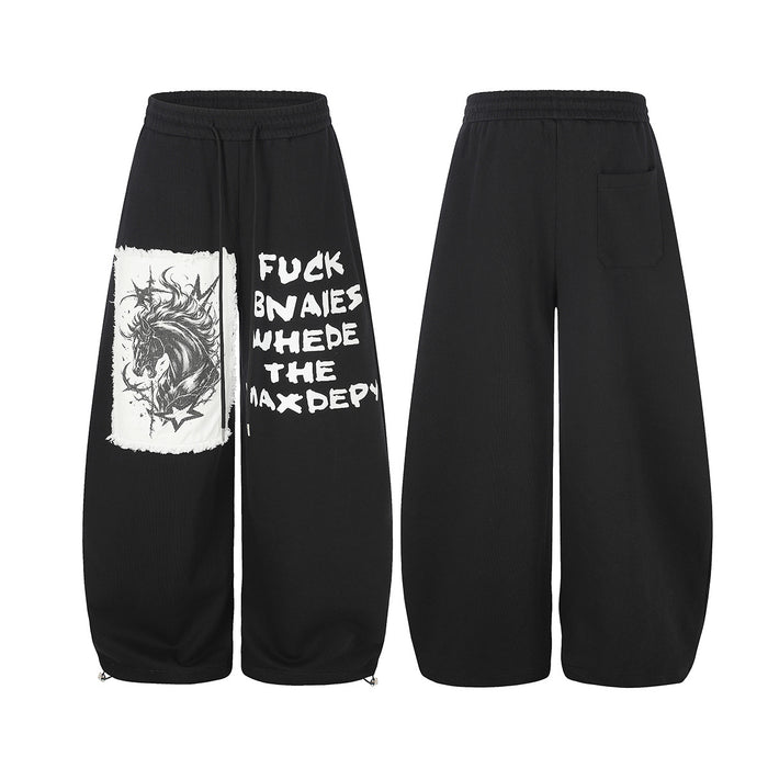 Black wide-leg sweatpants showing the front graphic and plain back with a rear pocket