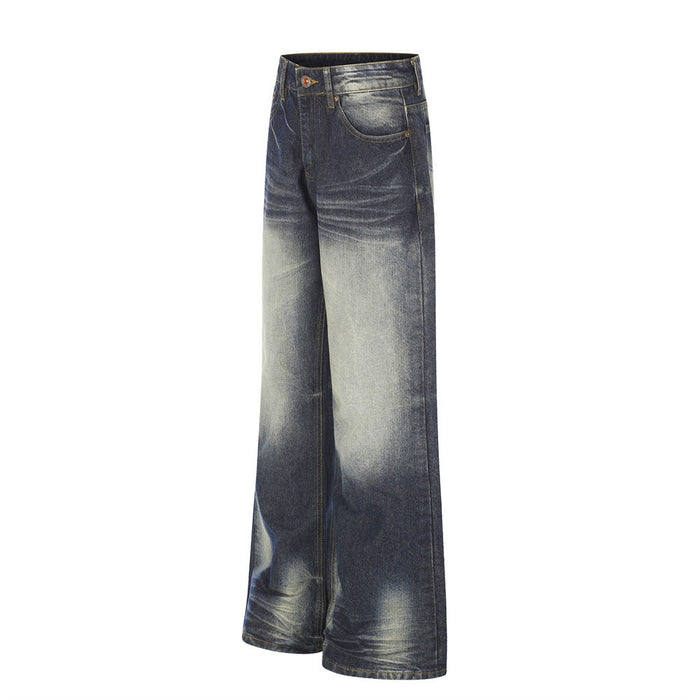 Three-quarter front view of wide-leg dark blue jeans showing the side seam, front pocket, and faded denim wash