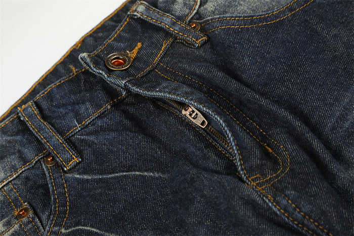 Open front fly close-up showing the metal button, zipper, belt loop, and contrast stitching