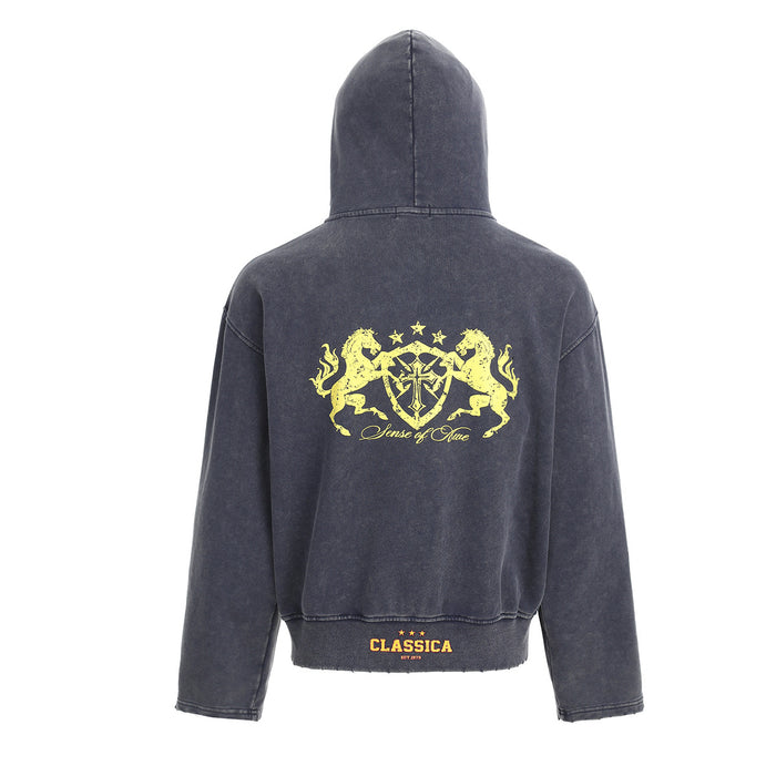 Back view of the dark charcoal cropped hoodie with a large yellow heraldic crest graphic and hem label