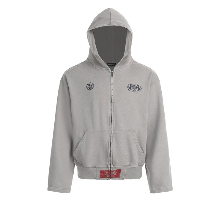 Light gray cropped zip-up hoodie front with hood, kangaroo pockets, dark chest crests, and ribbed hem