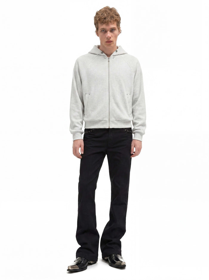 Light gray cropped zip-up hoodie modeled from the front with the hood resting behind the neck