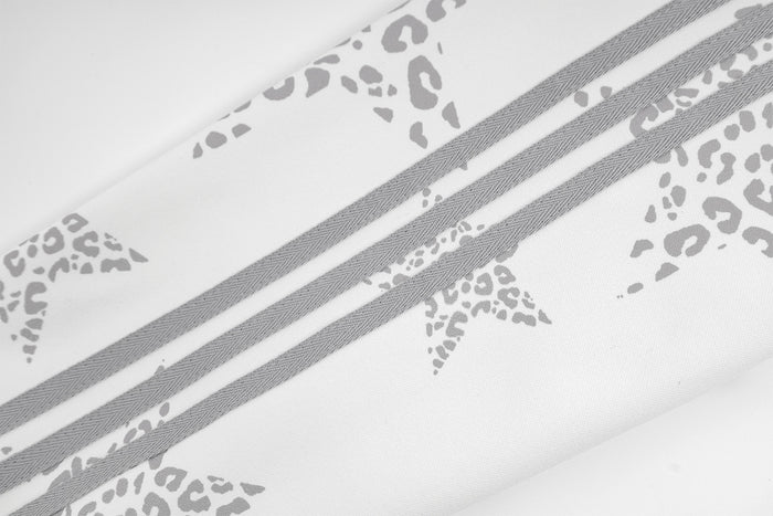 Close-up of double gray side stripes running alongside leopard-pattern star print