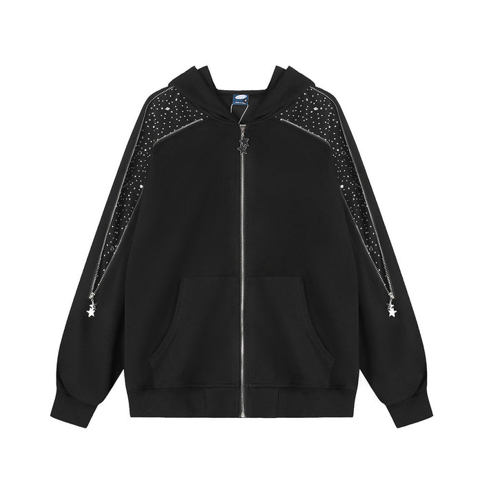 Oversized black zip-up hoodie with rhinestone scatter embellishment on shoulder panels and decorative silver star zipper pull