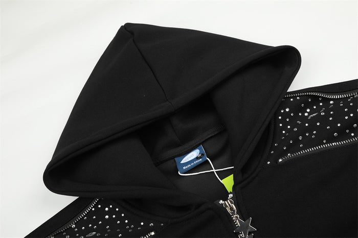 Close-up of the black hoodie hood and upper front, showing rhinestone detailing and star-shaped zipper pull