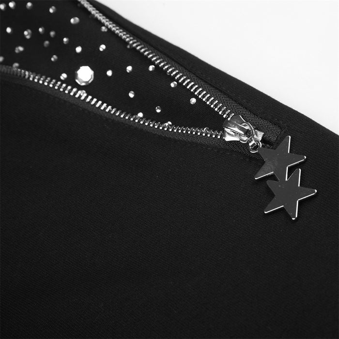 Close-up of a silver zipper with two star-shaped pulls and scattered rhinestones on black fabric